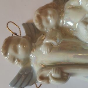 Porcelin ornament two angels with a lamb. Opalescent glaze. Perfect condition
